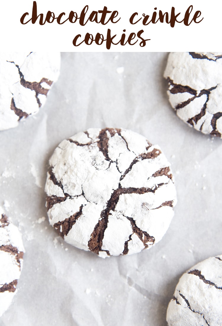 Chocolate crinkle cookies with powdered sugar on them.