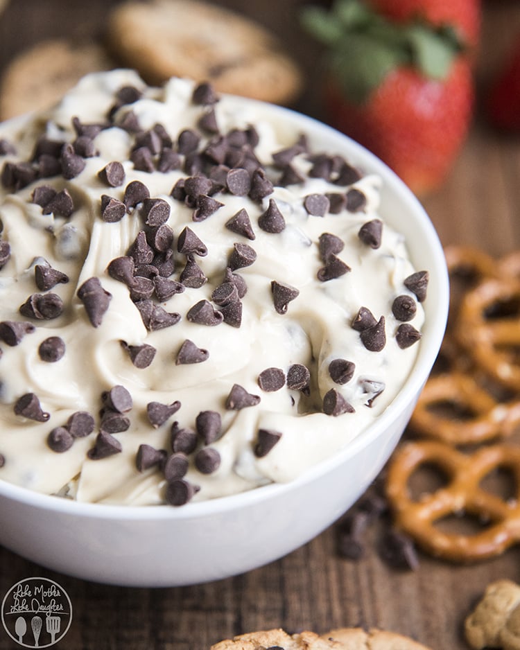 A bowl of chocolate chip cookie dough dip topped with mini chocolate chips.