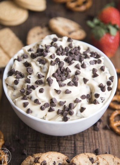 A bowl of cookie dough dip topped with mini chocolate chips.