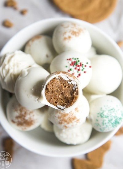 A bowl of gingerbread truffles dipped in white chocolate.