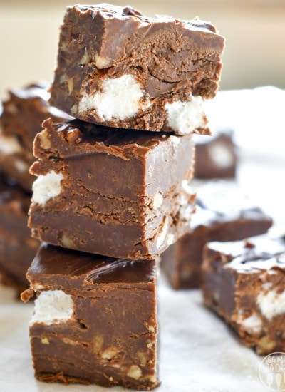 A stack of three pieces of rocky road fudge.