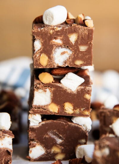 A stack of three pieces of rocky road fudge.