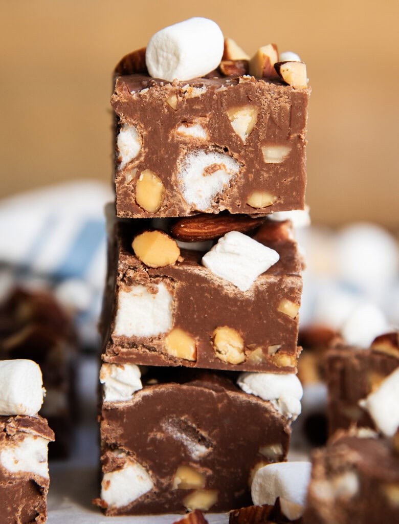 A stack of three pieces of rocky road fudge.