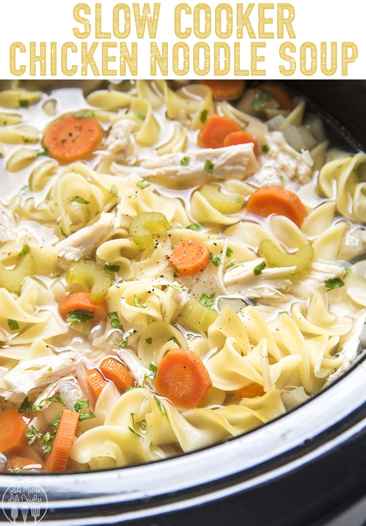 Slow cooker chicken noodle soup with carrots, celery, noodles and chicken in a crockpot.