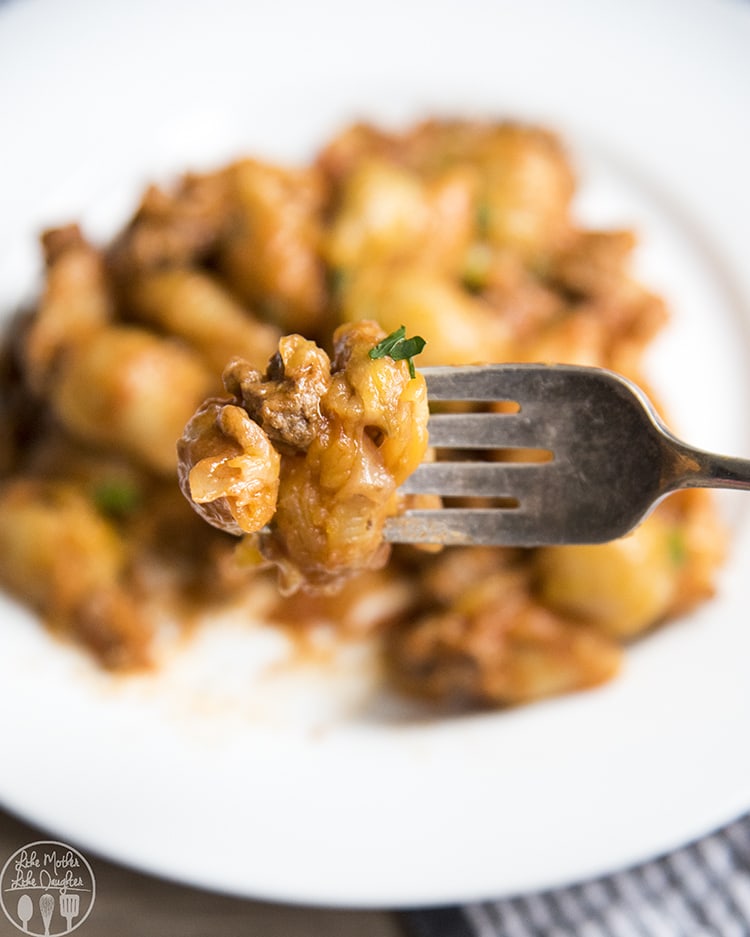 A bite of cheeseburger pasta on a fork.