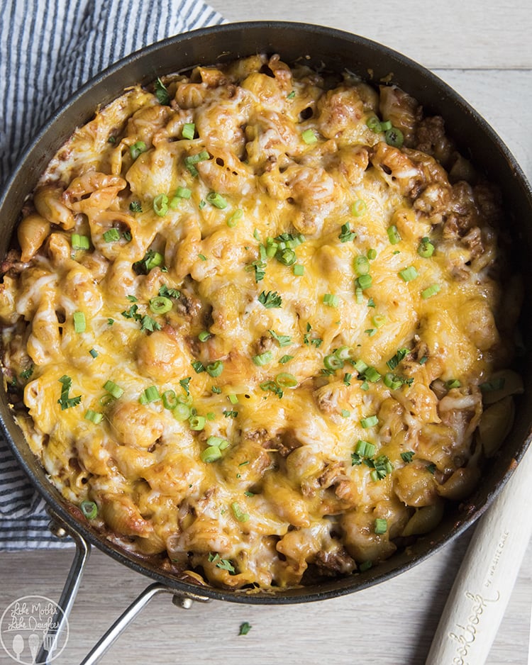 An overhead photo of one pot cheeseburger pasta topped with fresh green onions.