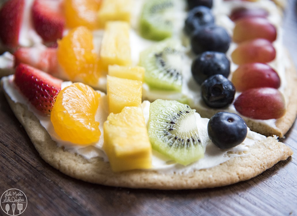 Fruit Pizza Decorated to look like a rainbow shape and colors of the fruit