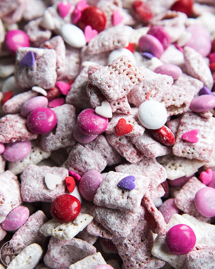 A close up of a pie of Valentine Muddy Buddies cereal mix. 