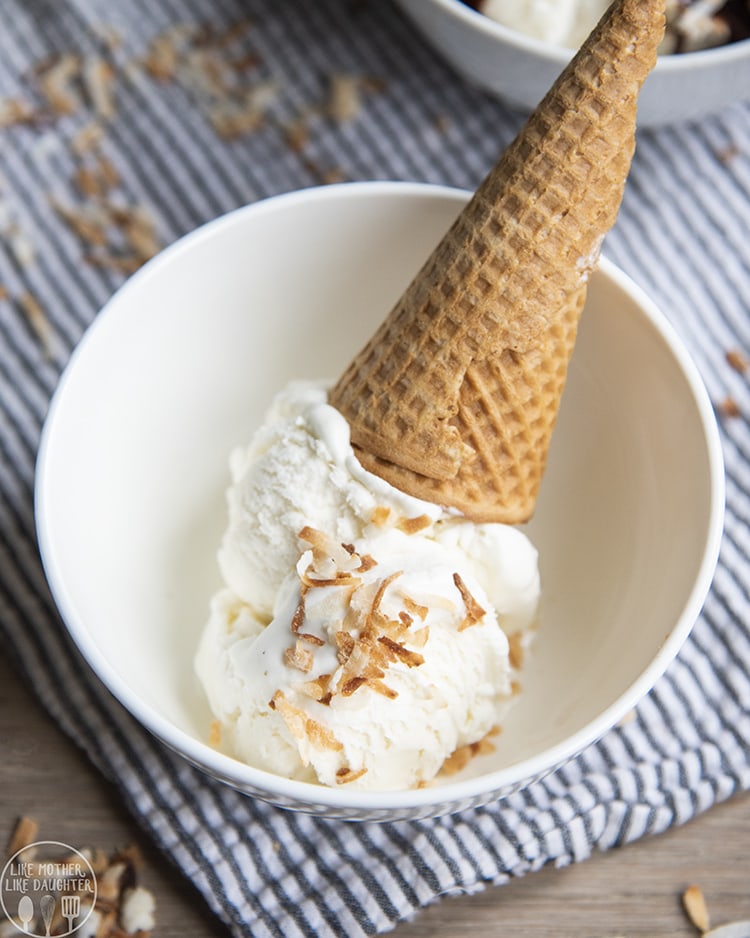 Coconut Ice Cream in a cone with toasted coconut flakes