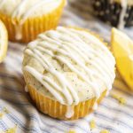 A lemon poppyseed muffin topped with icing.