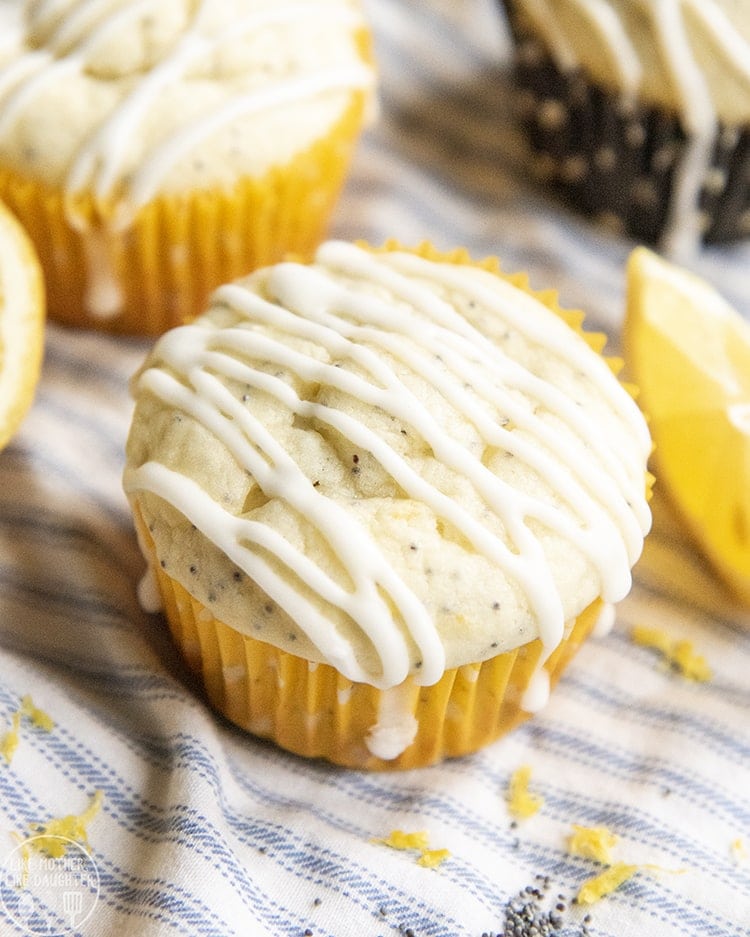 A lemon poppyseed muffin topped with icing.