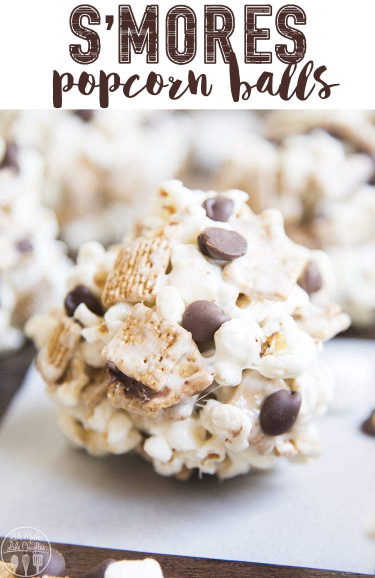 A smores popcorn ball with chocolate chips and golden graham cereal in it.