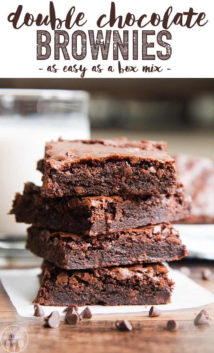 A stack of 4 fudgy brownies with crinkled tops. 