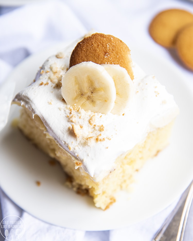 A slice of banana pudding poke cake