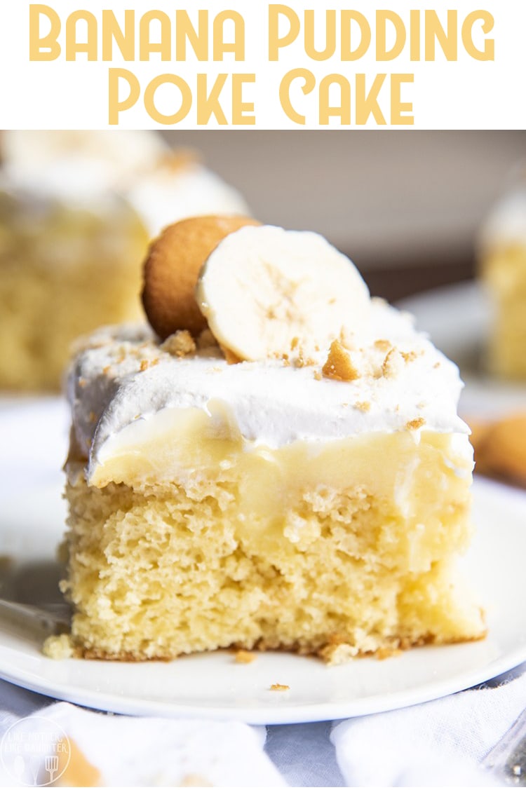 A piece of cake topped with banana pudding, whipped cream, and a banana slice. 