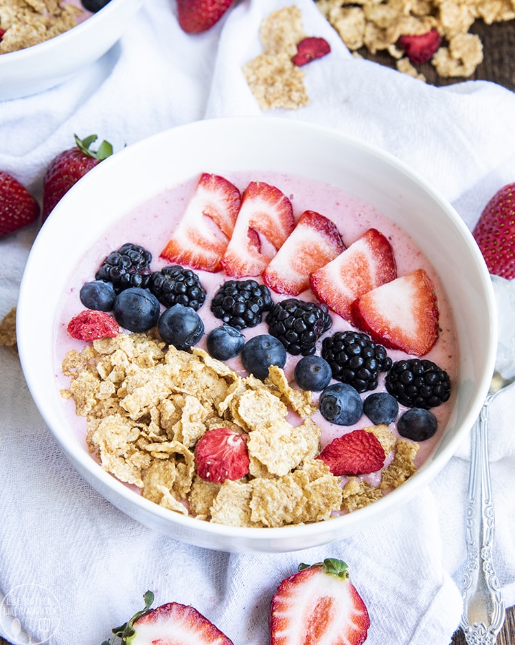 Strawberry Smoothie bowl with berries and almonds on top