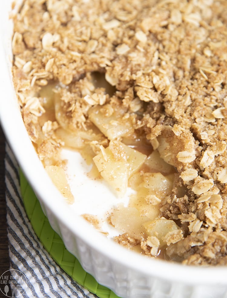 A baking pan of apple streusel with diced apples and oatmeal topping.