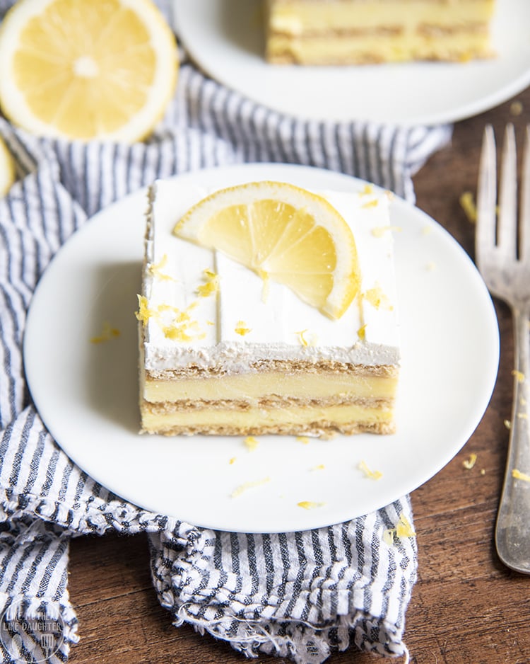A piece of lemon icebox cake on a white plate. 