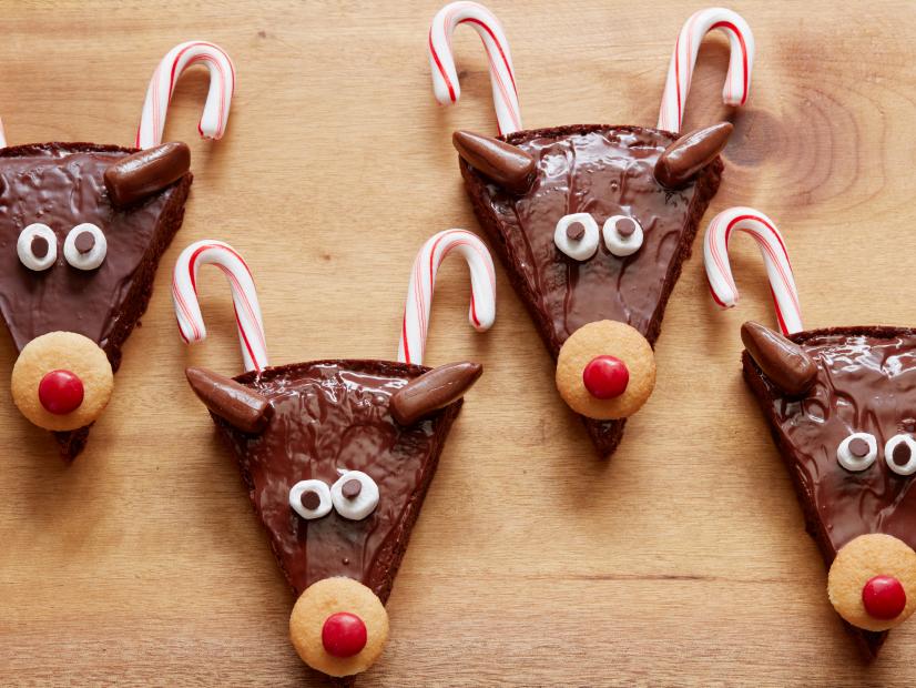 Brownies decorated with candy canes to look like antlers, and red noses to make them look like reindeer. 