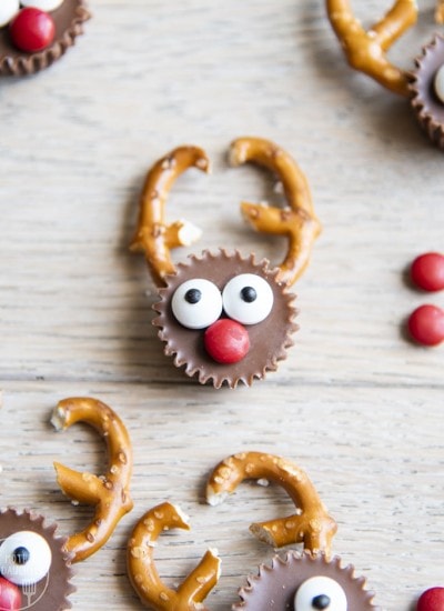 A mini peanut butter cup decorated to look like a r reindeer.