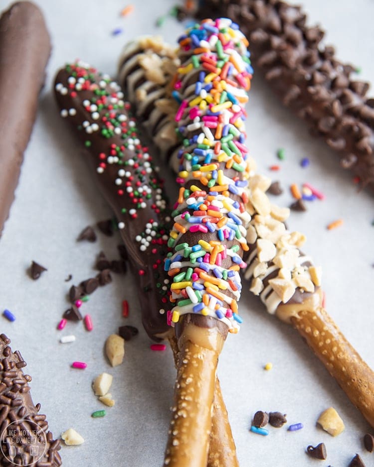 Chocolate and caramel covered pretzel rods topped with sprinkles. 