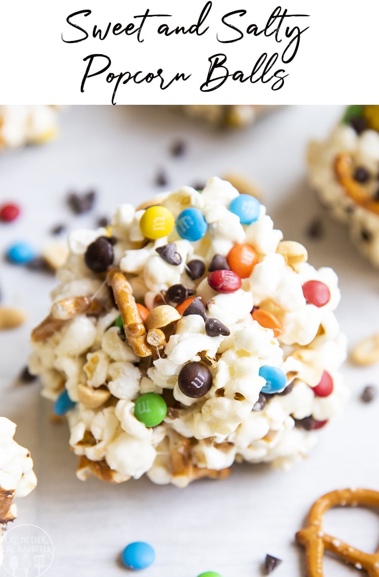 A popcorn ball loaded with pieces of pretzels, peanuts, m&ms, and chocolate chips.