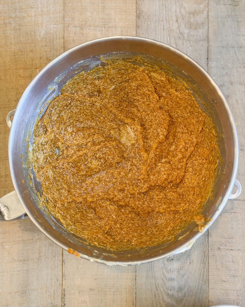 A bowl of pumpkin muffin batter.