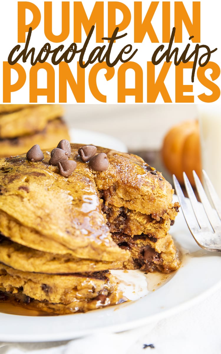 A stack of pumpkin pancakes topped with chocolate chips, and with a bite taken out of each.