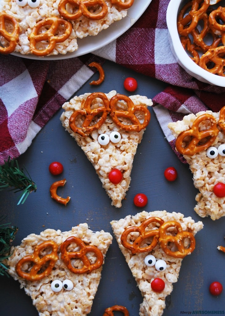 Rice krispie treats decorated into reindeer with pretzel antlers. 