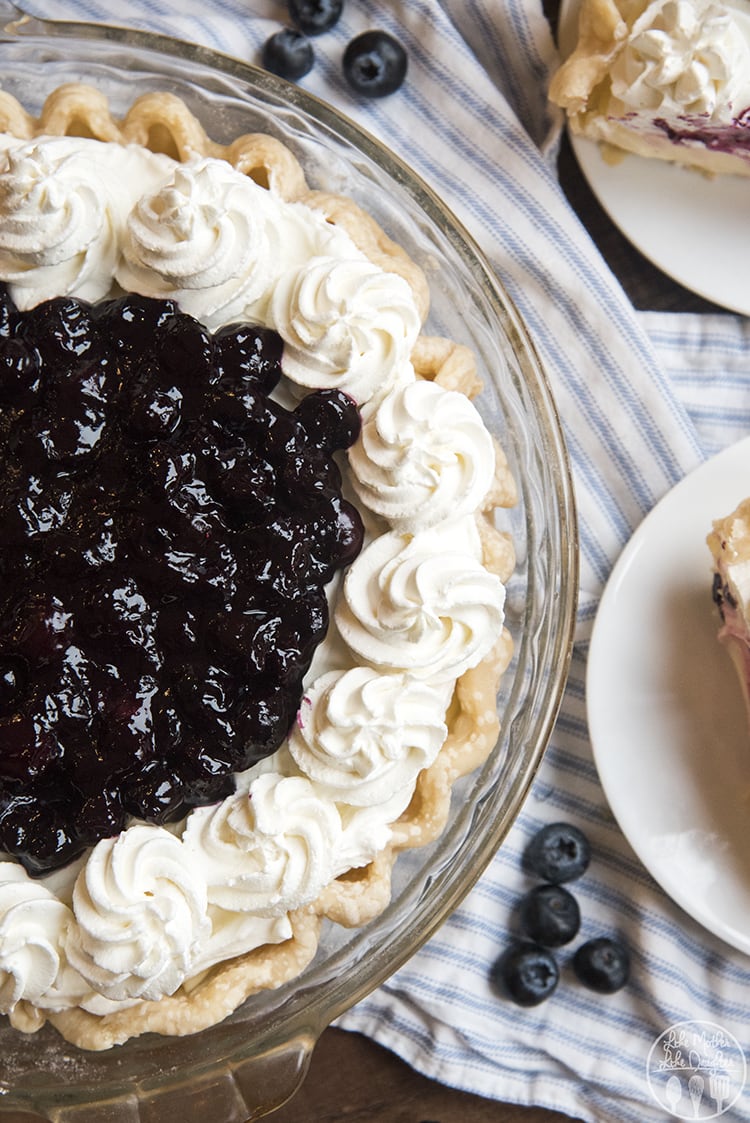 Lemon Sour Cream pie topped with blueberry sauce