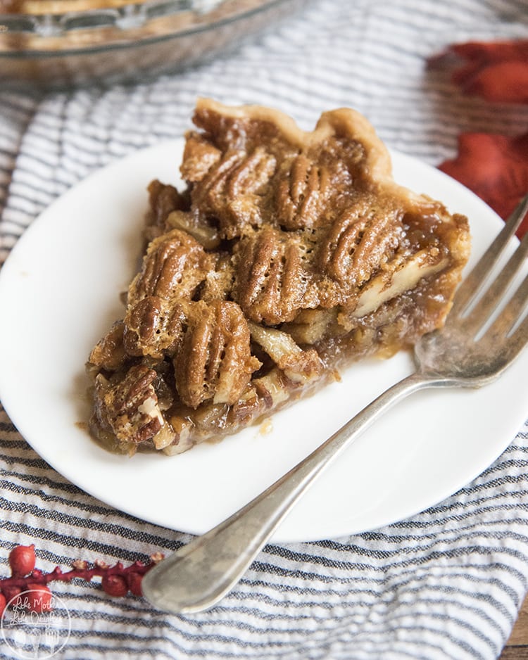 A slice of pecan pie is perfect with a gooey sugary filling and pecans