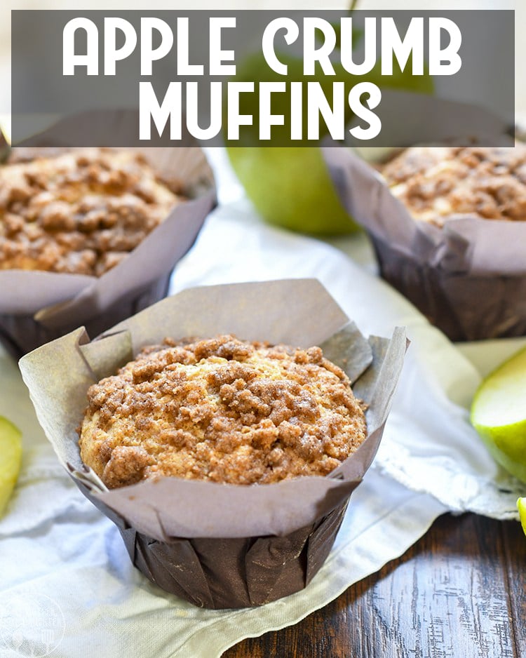 Angled view of apple crumb muffins in paper wraps with title card.