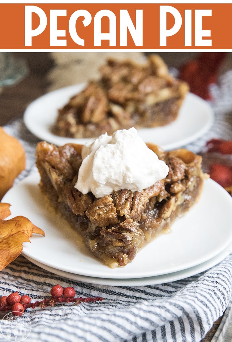 A piece of pecan pie on a plate, with whipped cream on top.
