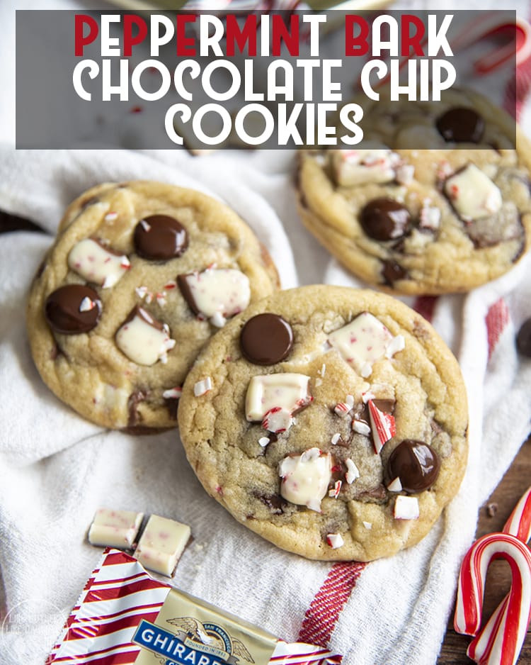 Three peppermint bark cookies topped with chocolate chips and peppermint bark pieces. 