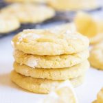 A slice of lemon cookies with powdered sugar crinkled around them.