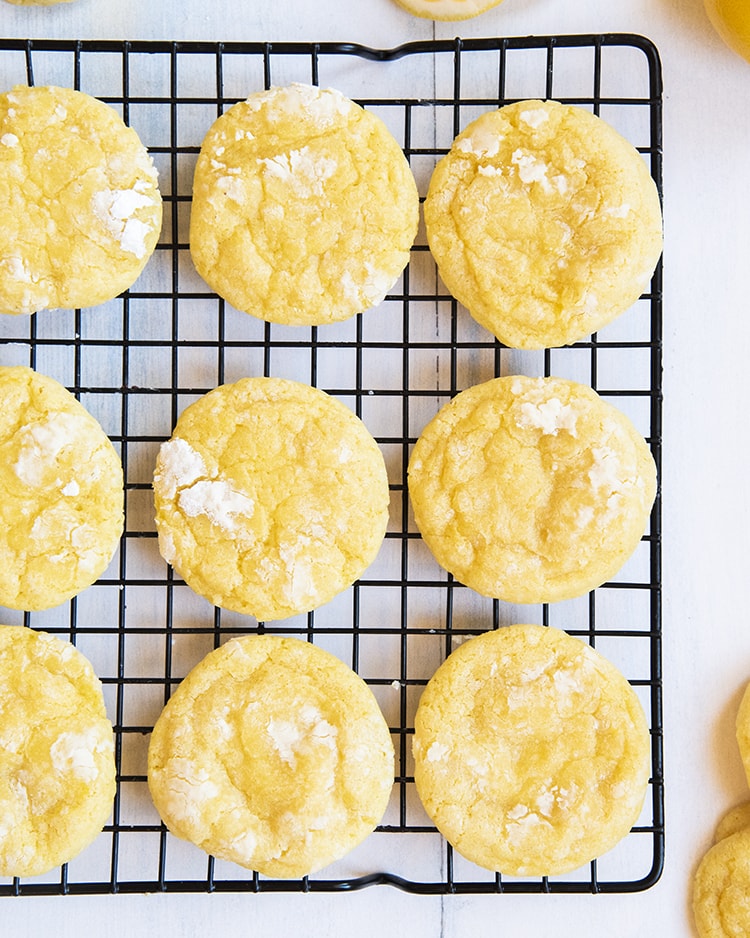 Lemon Crinkle Cookies coated in powdered sugar for a perfect tray of sunshine