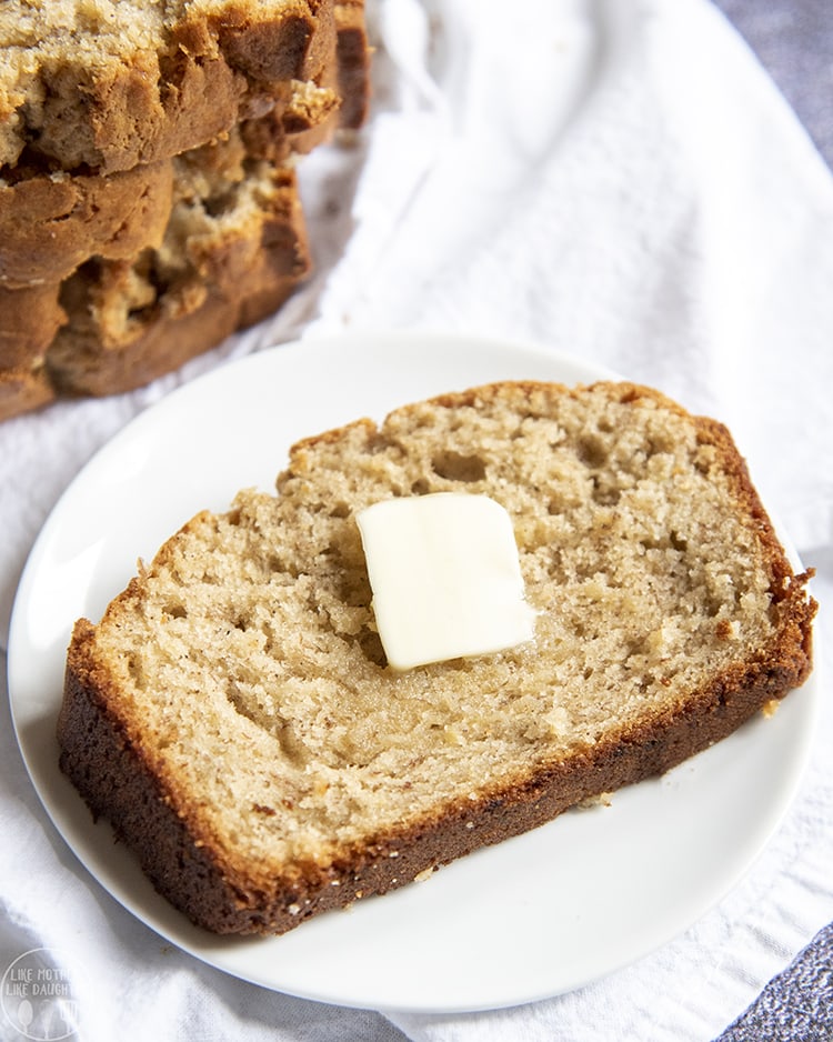 Thick banana bread slice topped with butter
