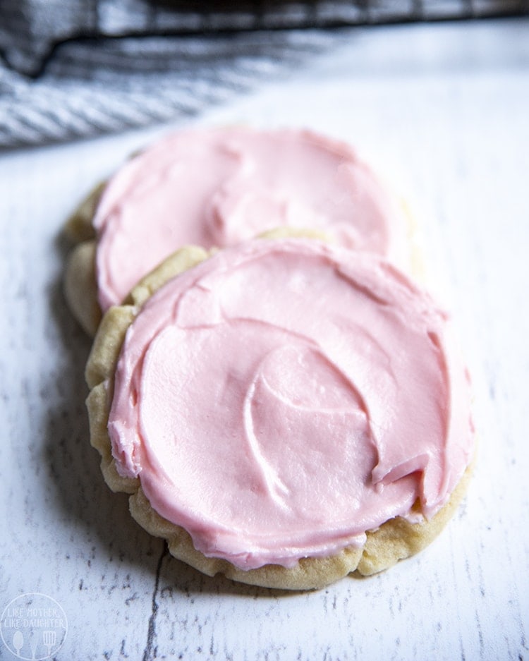 Close up image of copycat swig sugar cookies with pink frosting on top.