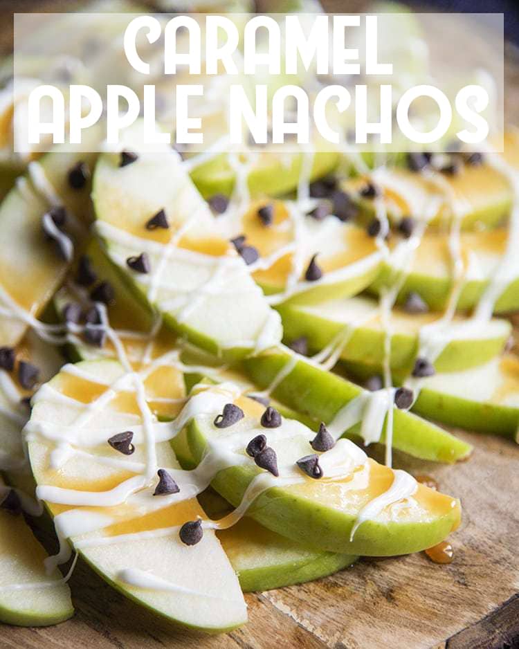 Close up image of apple nachos showing sliced apples with caramel and mini chocolate chips on top.
