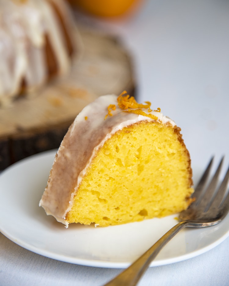 A slice of orange bundt cake made with a cake mix