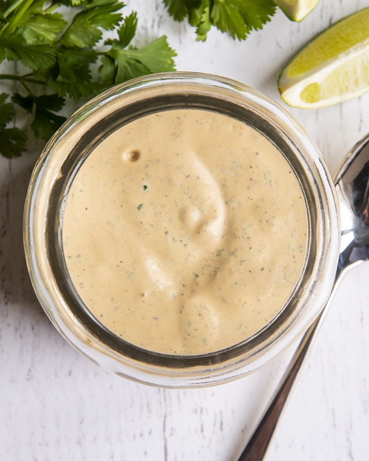 An overhead shot of chipotle ranch in a jar
