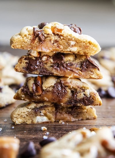 A stack of caramel pretzel chocolate chip cookies showing the middle of the cookie