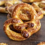 Close up image of soft pretzel with salt on top.
