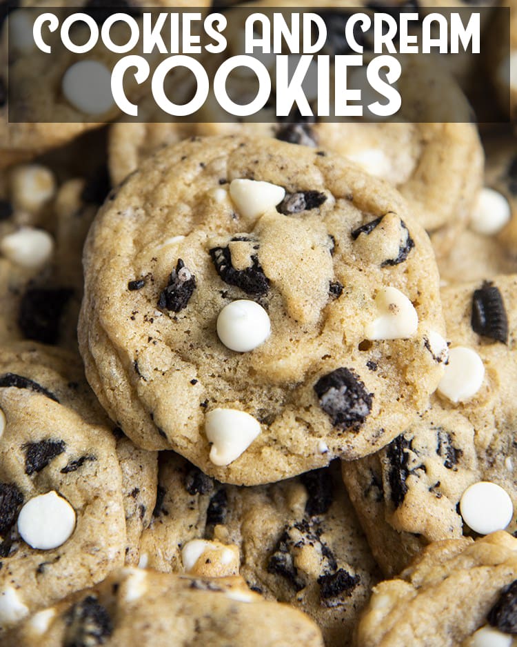 Close-up image of cookies and cream cookies with cookie pieces and white chocolate chips with title of same description.