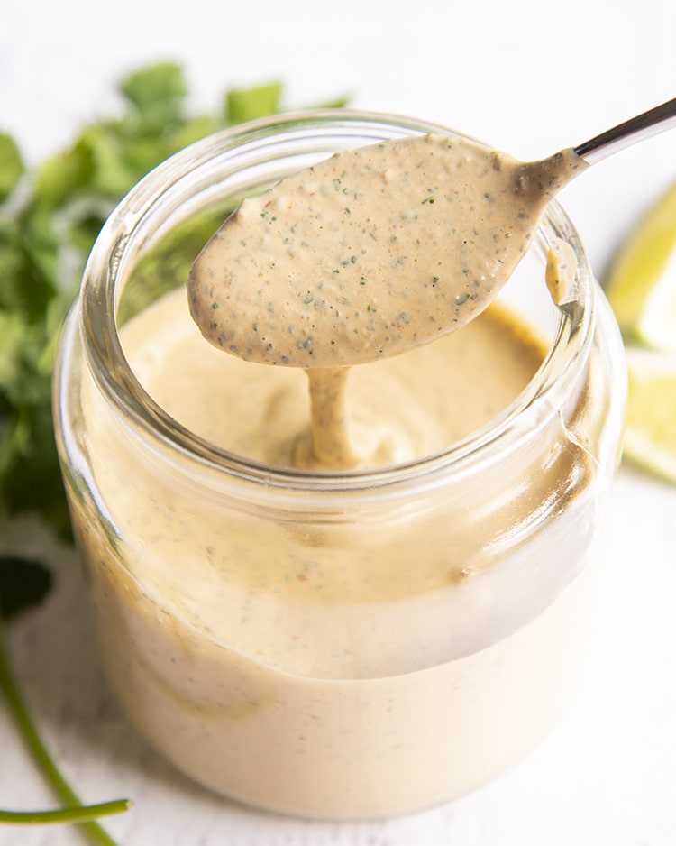 A spoonful of chipotle ranch over a jar