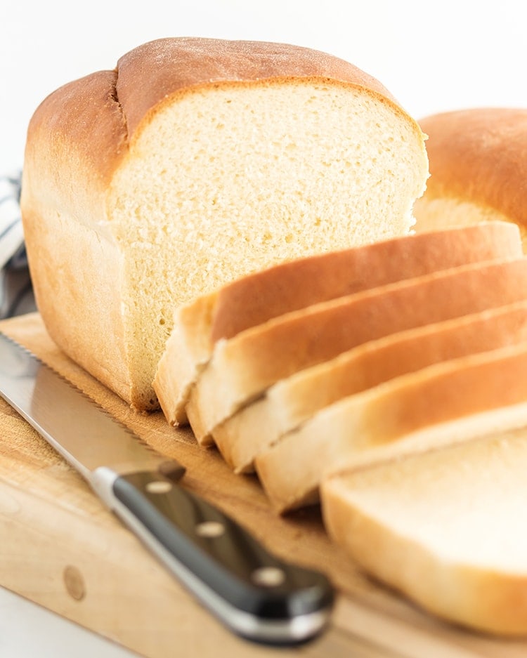 A loaf of white bread cut into slices