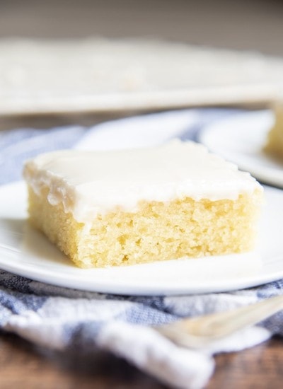 A slice of white texas sheet cake on a plate