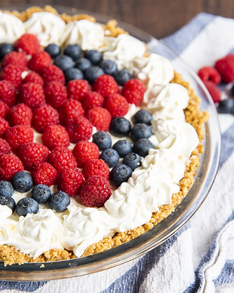 Red White and Blueberry Cheesecake (No Bake) displayed up close with berries on top