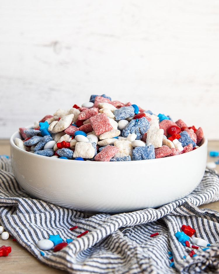 Red, White and Blue Muddy Buddies in a big white bowl.