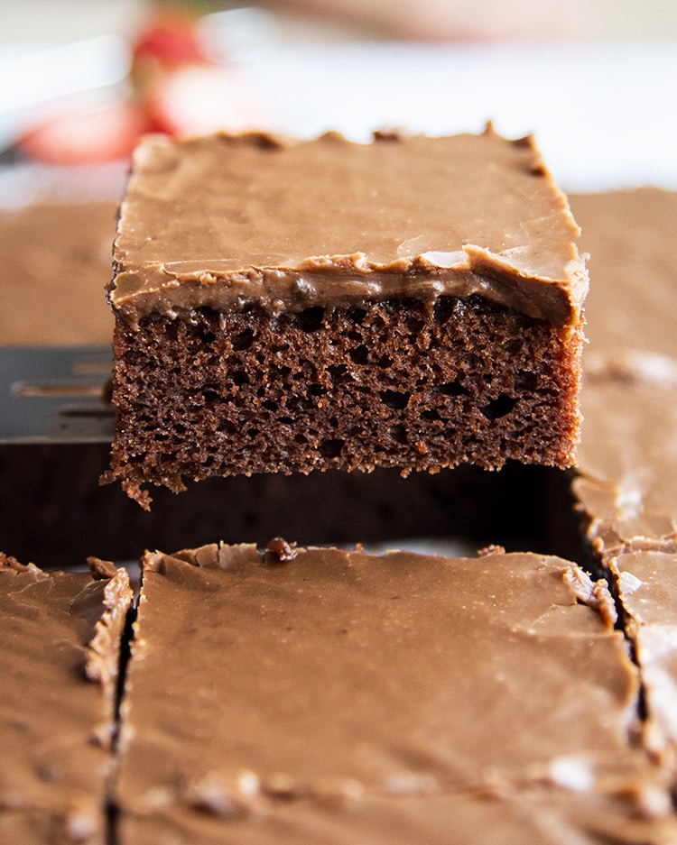 A slice of Texas sheet cake on a spatula